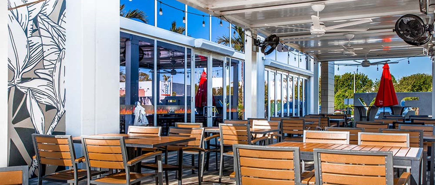 West Delray covered patio with long high-top tables